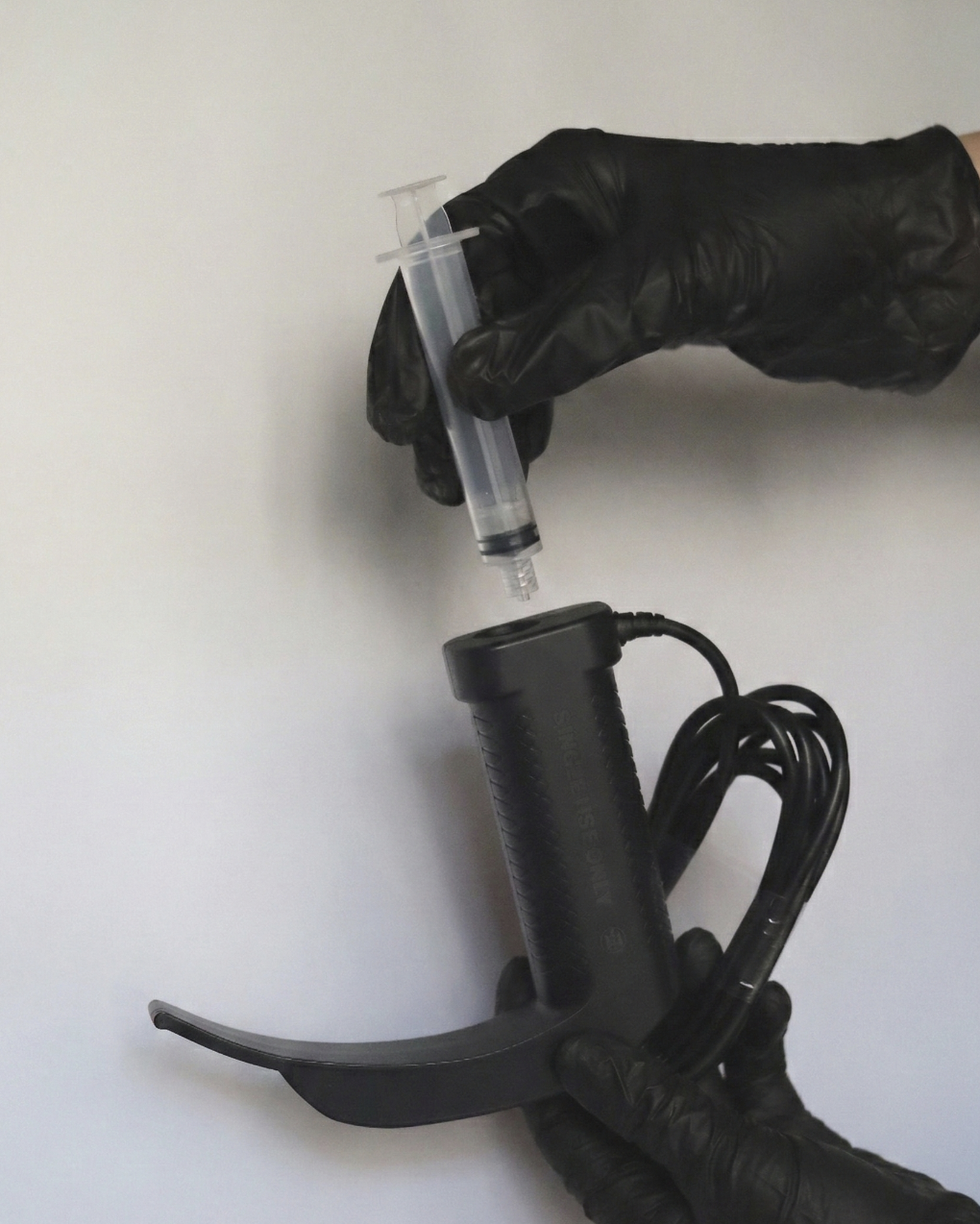 Close-up of the IntuBlade Luer-lock channel receiver on the handle